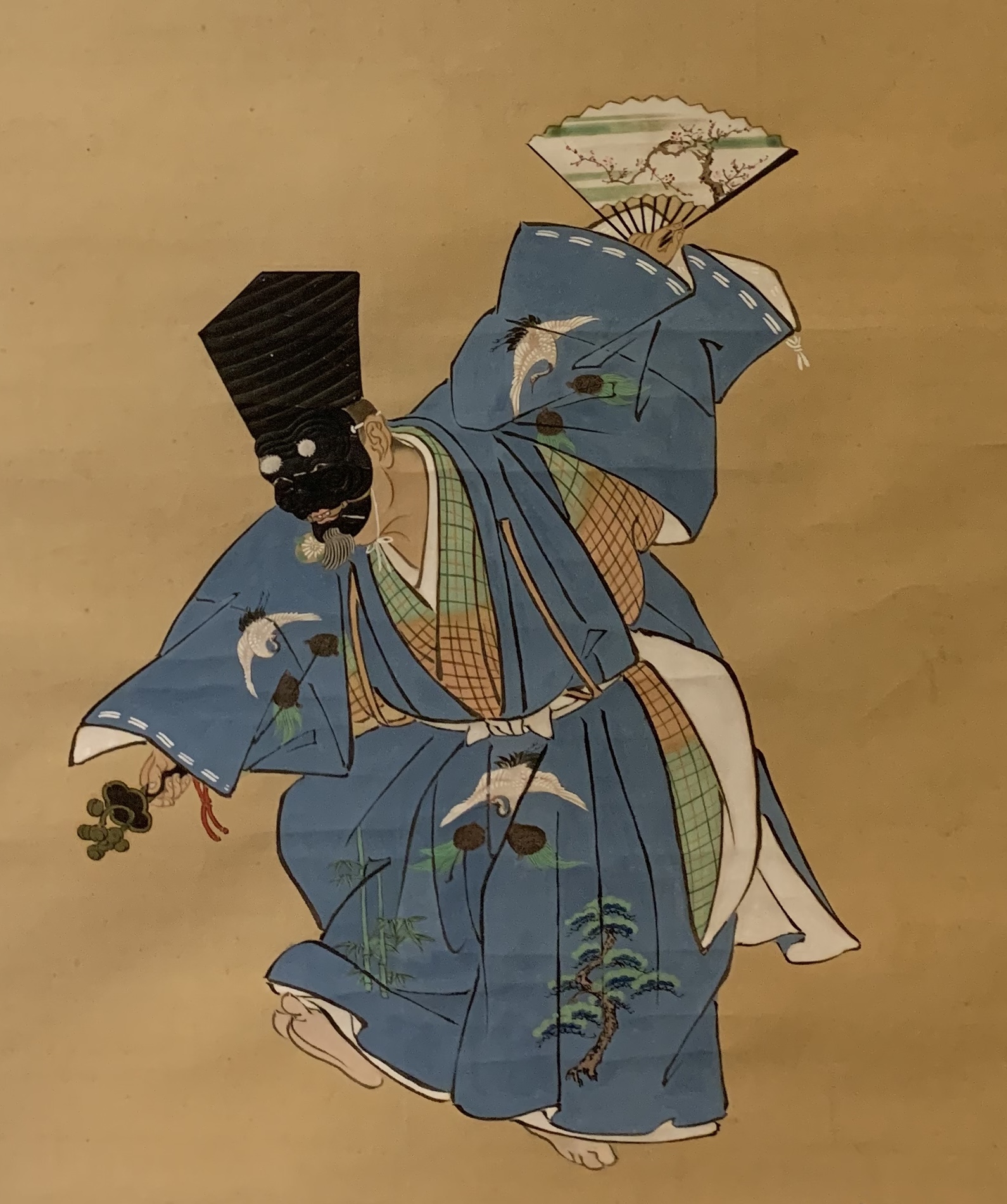 青い装束で舞う人物の古画